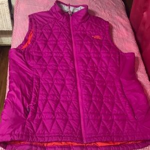 The North face vest excellent condition pink with orange interior.
